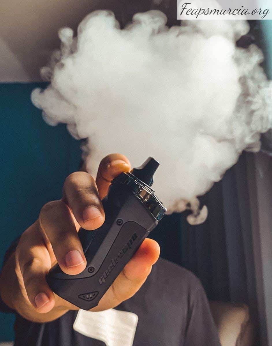 Person Holding Black Vape